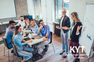 Training consultants presenting to an engaged team during a professional development session